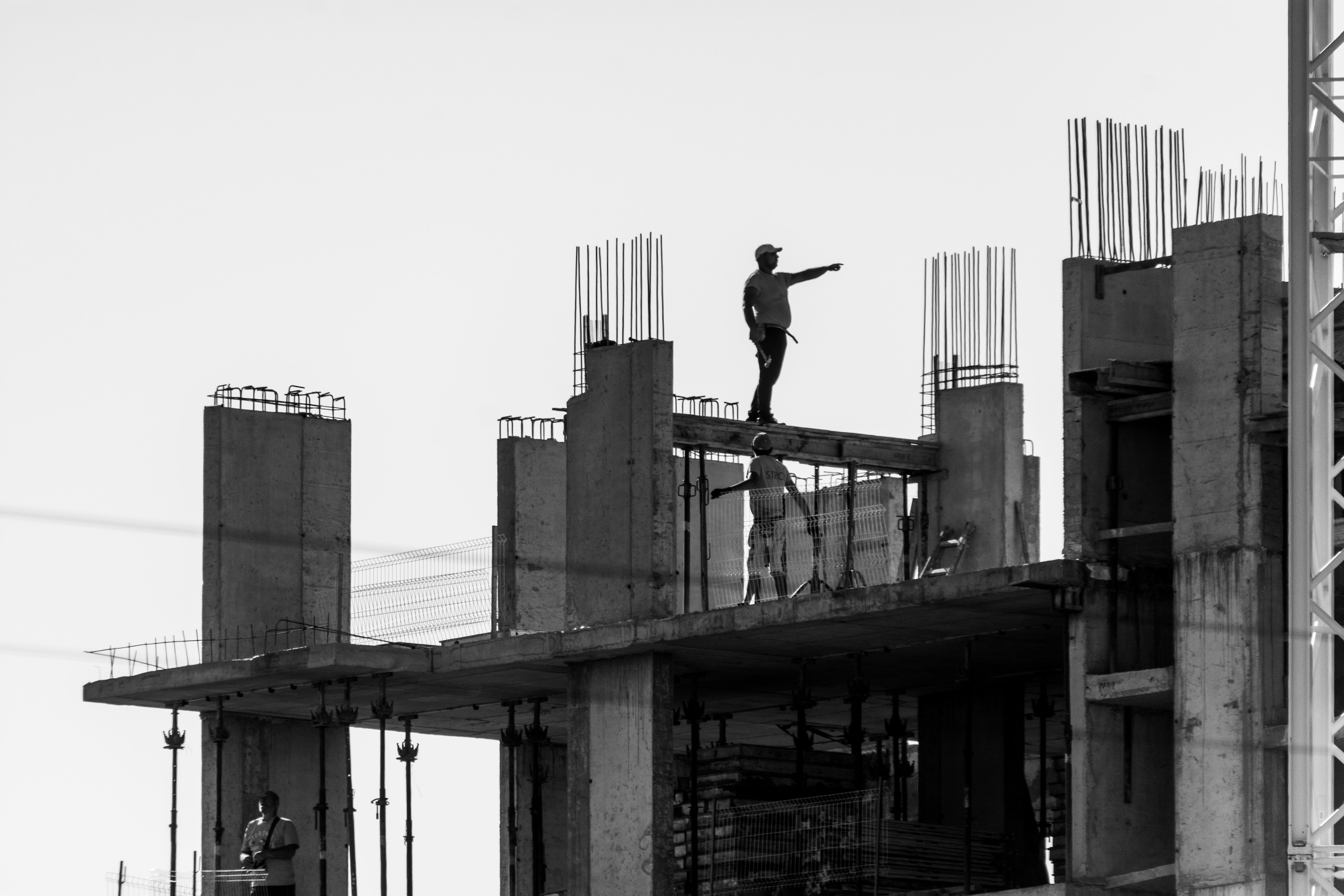 Skilled construction workers performing exterior home improvement work with professional technique
